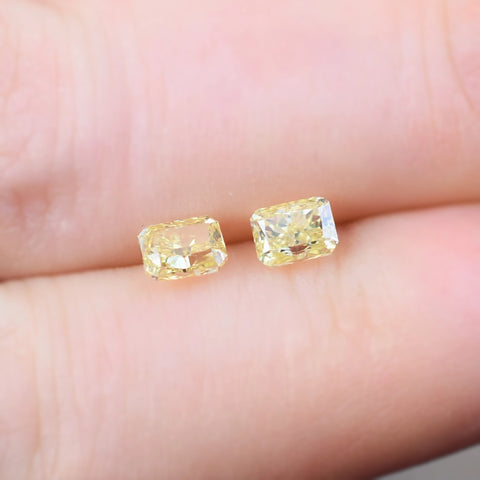 Matched Pair of Radiant Cut Fancy Yellow Diamonds, 1.01 Carat Combined Weight
